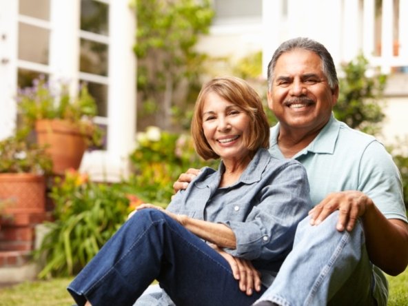Older couple smiling together outdoors after resolving a timeshare issue